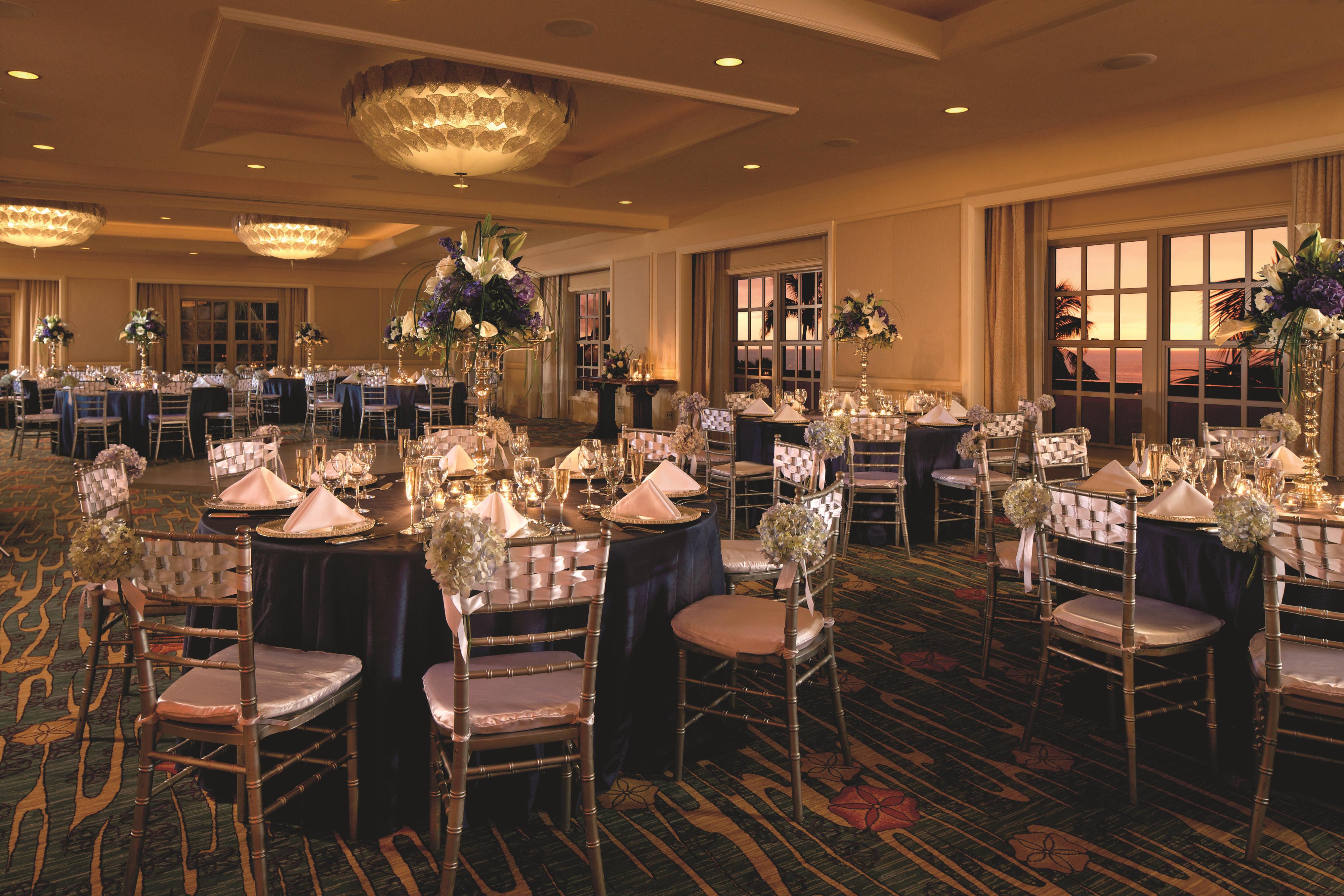 Banquet room with round tables and florals
